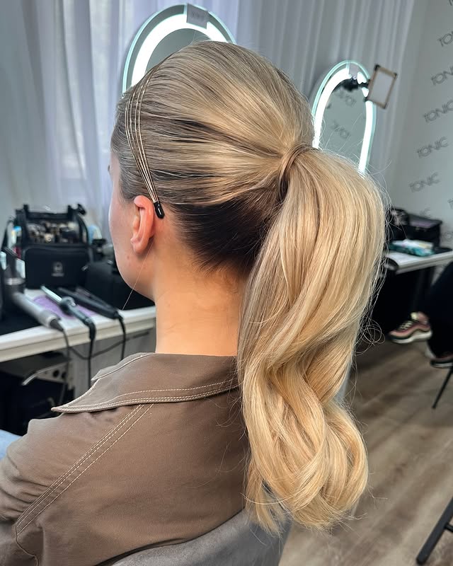 Classic High Ponytail With Smooth Waves