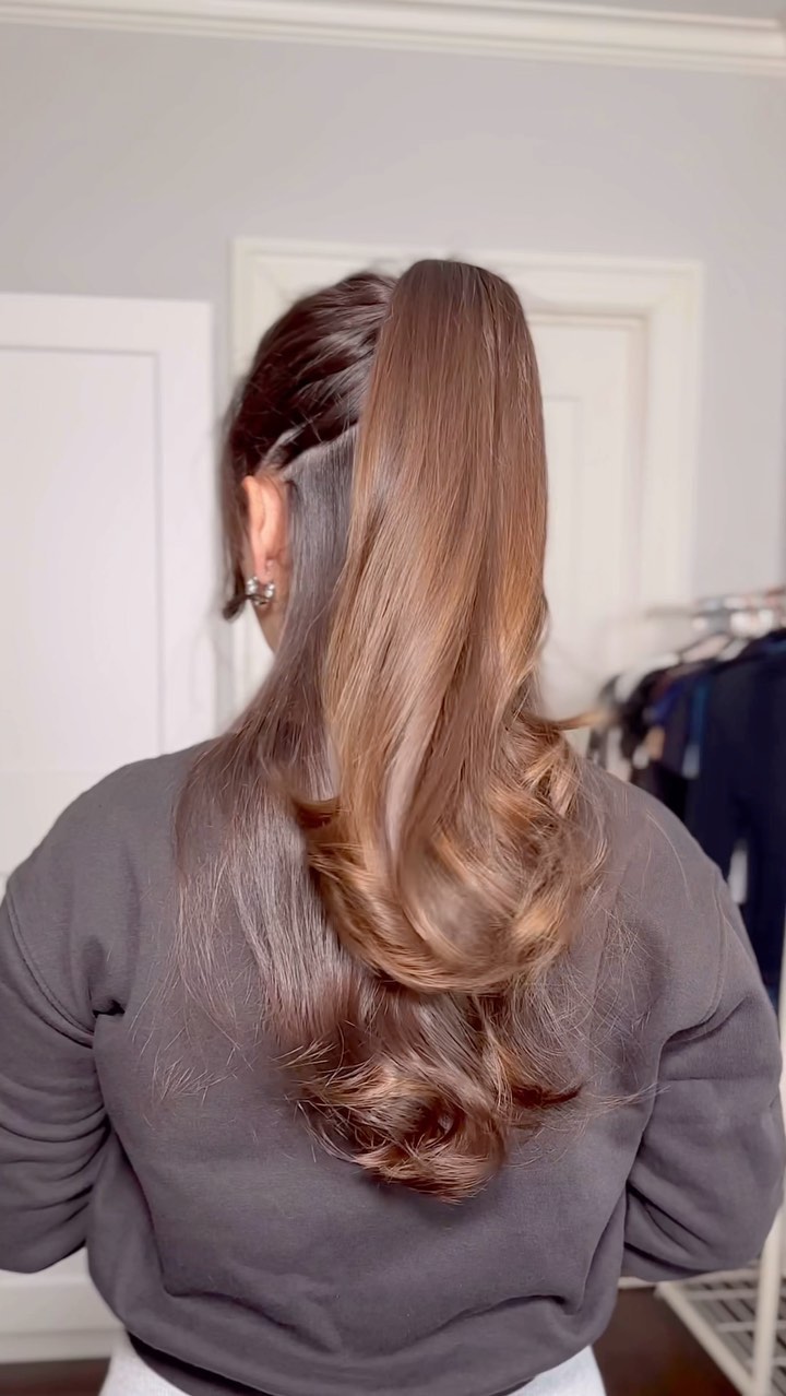 High Voluminous Ponytail With Rich Auburn Curls