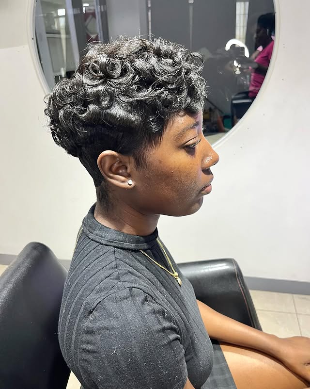 Mob Pixie with Wavy Black Hair and Temple Fade