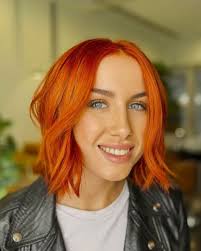Orange Pixie Blowout Haircut With Bangs and Layers