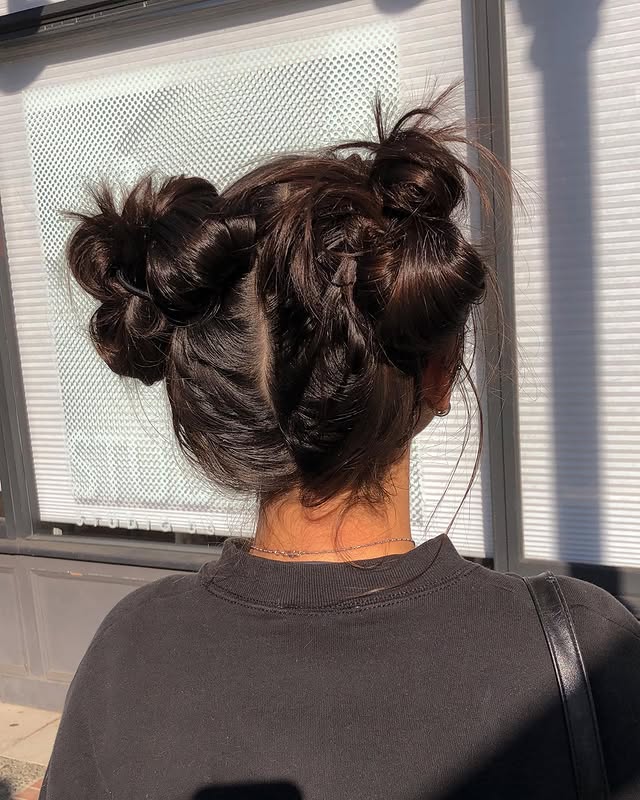 Playful Double Buns With Loose Waves
