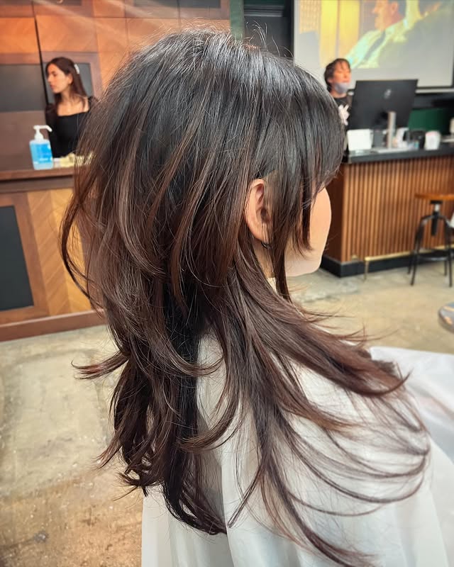 Soft Face-Framing Voluminous Blowout with Wispy Curtain Layers