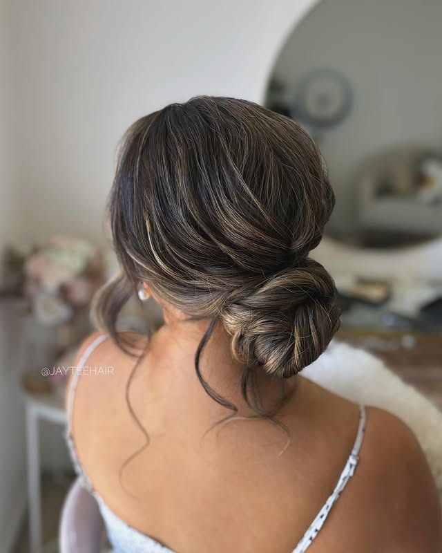 Textured Low Bun with Soft Loose Strands